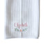 White textured towel with embroidered name 'Elizabeth' and floral design on a light gray background