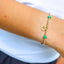 Gold bracelets with pearls and charms on a wrist against a white background - {Pre-Order} Limited Edition egives to Camp Mystic Bracelet - Houston, Texas 
